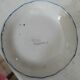 Assiette decorative en faience signé