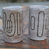 2 ceramic mugs signed db