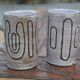 2 mugs en céramique signés db