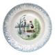 Vintage hollow serving dish with a decoration: marsh landscape.