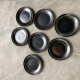 7 black ceramic plates
