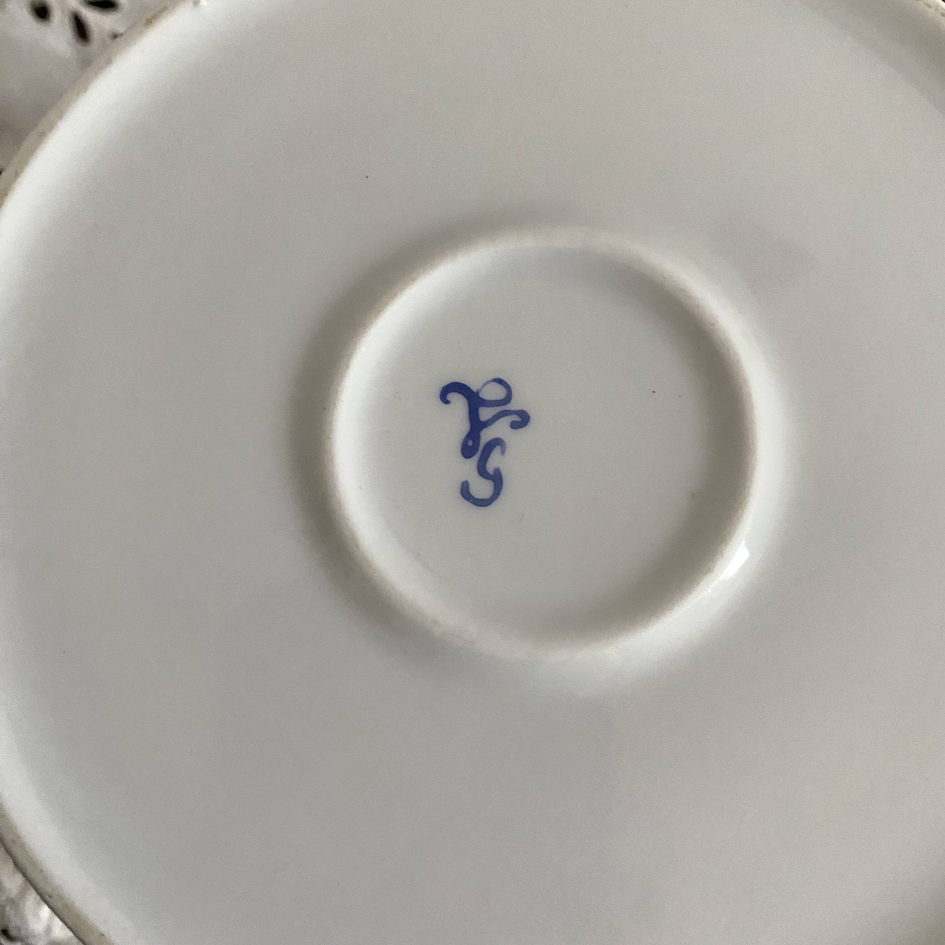 Porcelain teapot with hand-painted bird decoration