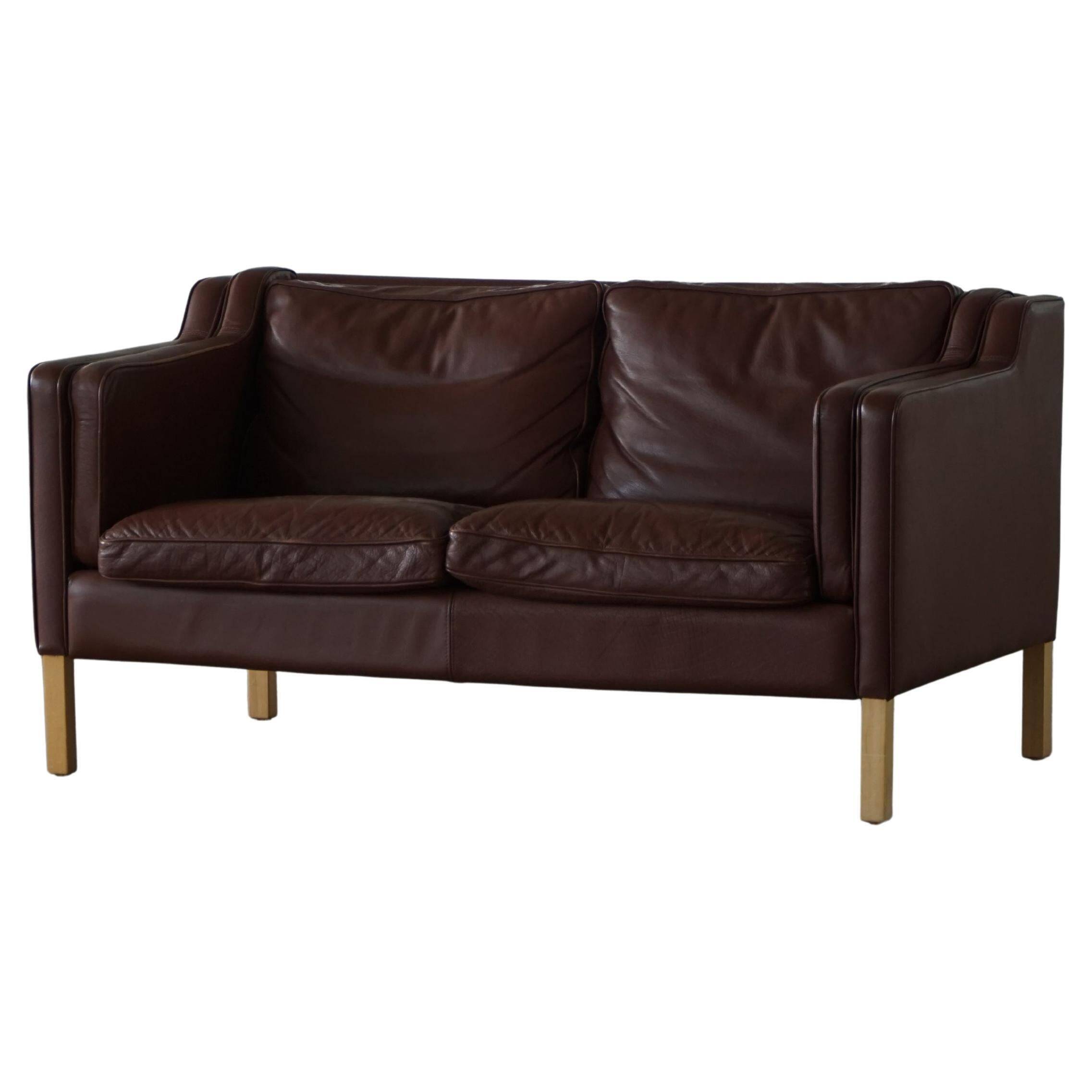 Stouby Møbelfabrik, two-seater sofa in mid-century style in brown leather, 1970s.