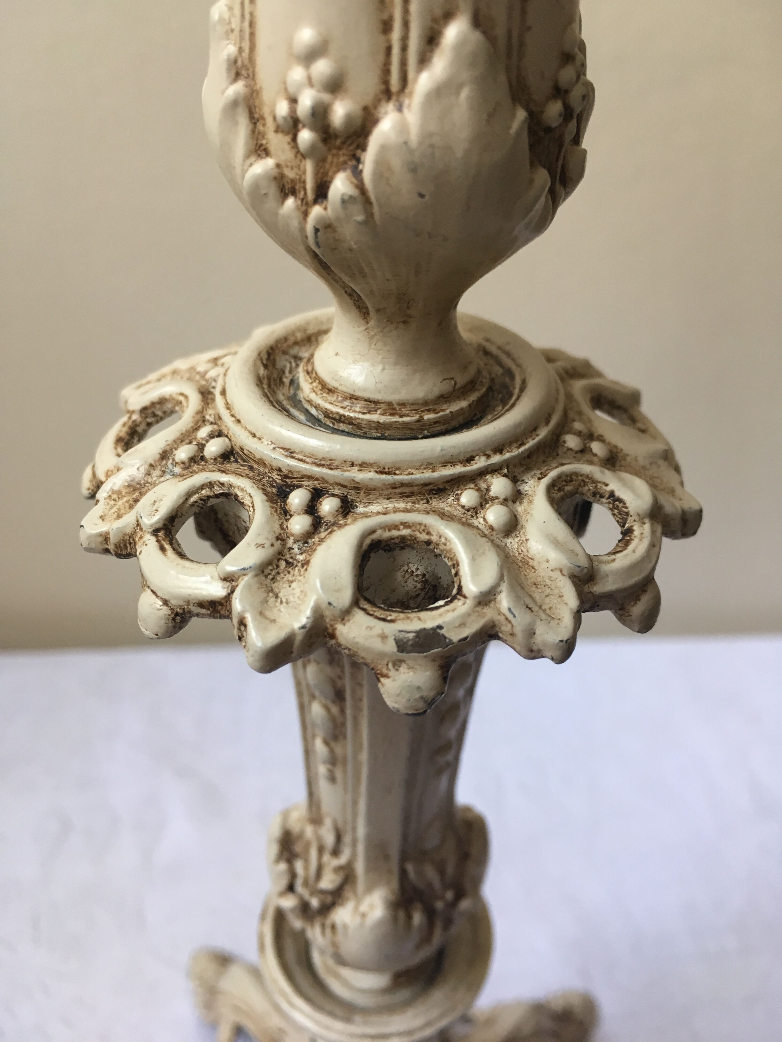 Large candle holder in patinated white painted metal