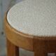 Mid-century Danish stool in oak, reupholstered in boucle wool, circa 1950.