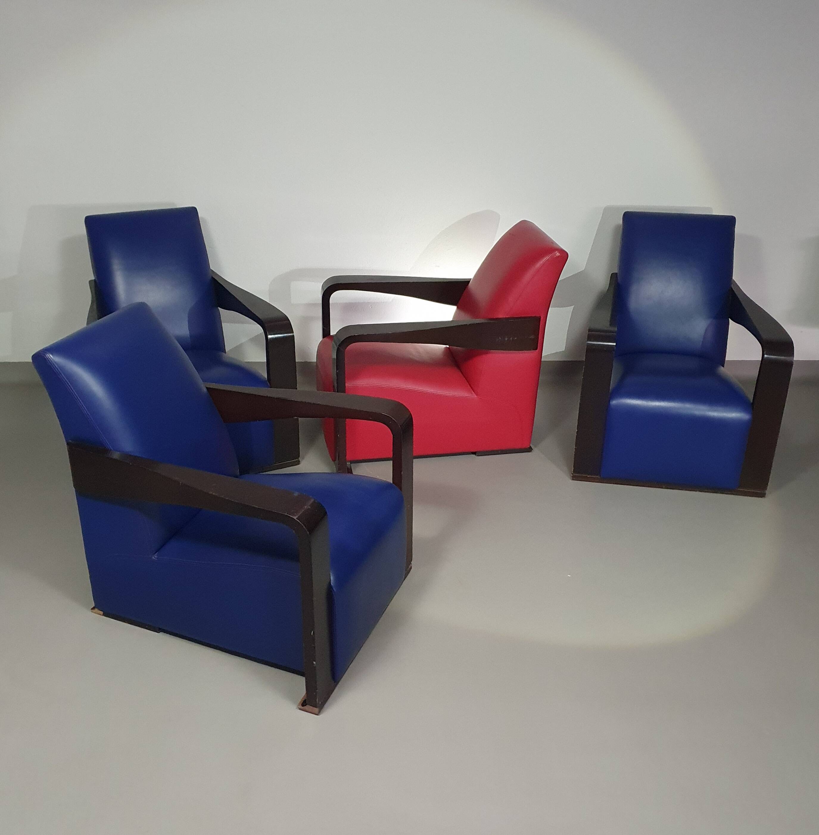 4 x Vintage Ying lounge chairs / fauteuils van Hugues Chevalier,'90. 3 x blue / 1 x red leather
