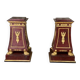 Pair of plaster bases imitating porphyry and gilded bronze circa 1980.