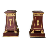Pair of plaster bases imitating porphyry and gilded bronze circa 1980.