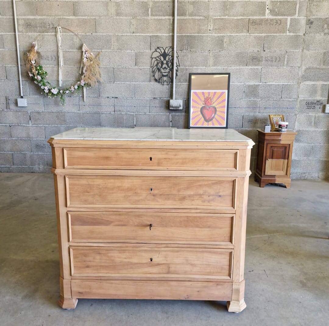 Walnut chest of drawers with white marble.