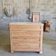 Walnut chest of drawers with white marble.
