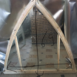 Metal mirror in the shape of an ogive