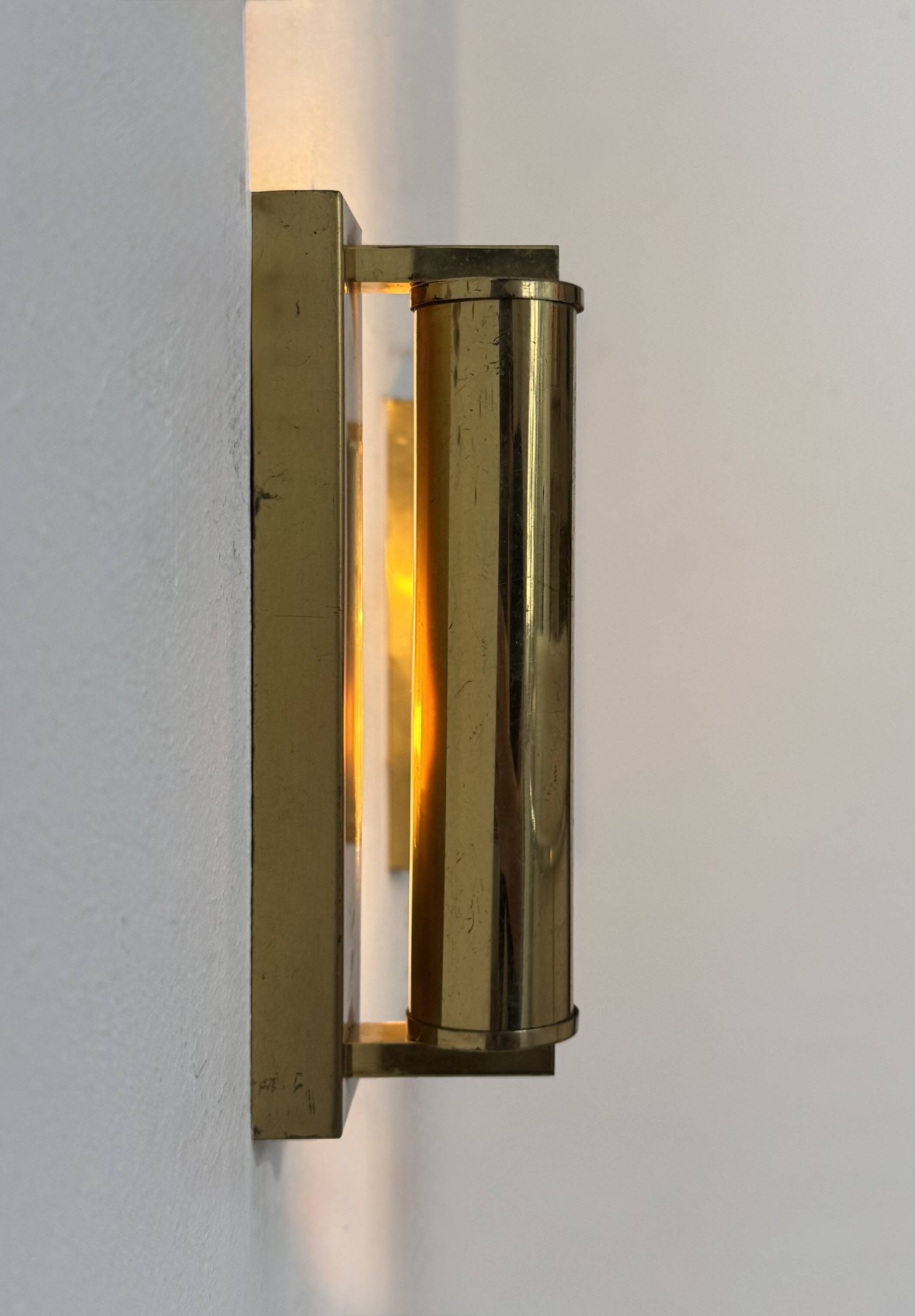 Pair of vintage modernist adjustable wall lights, brass, France 1970.