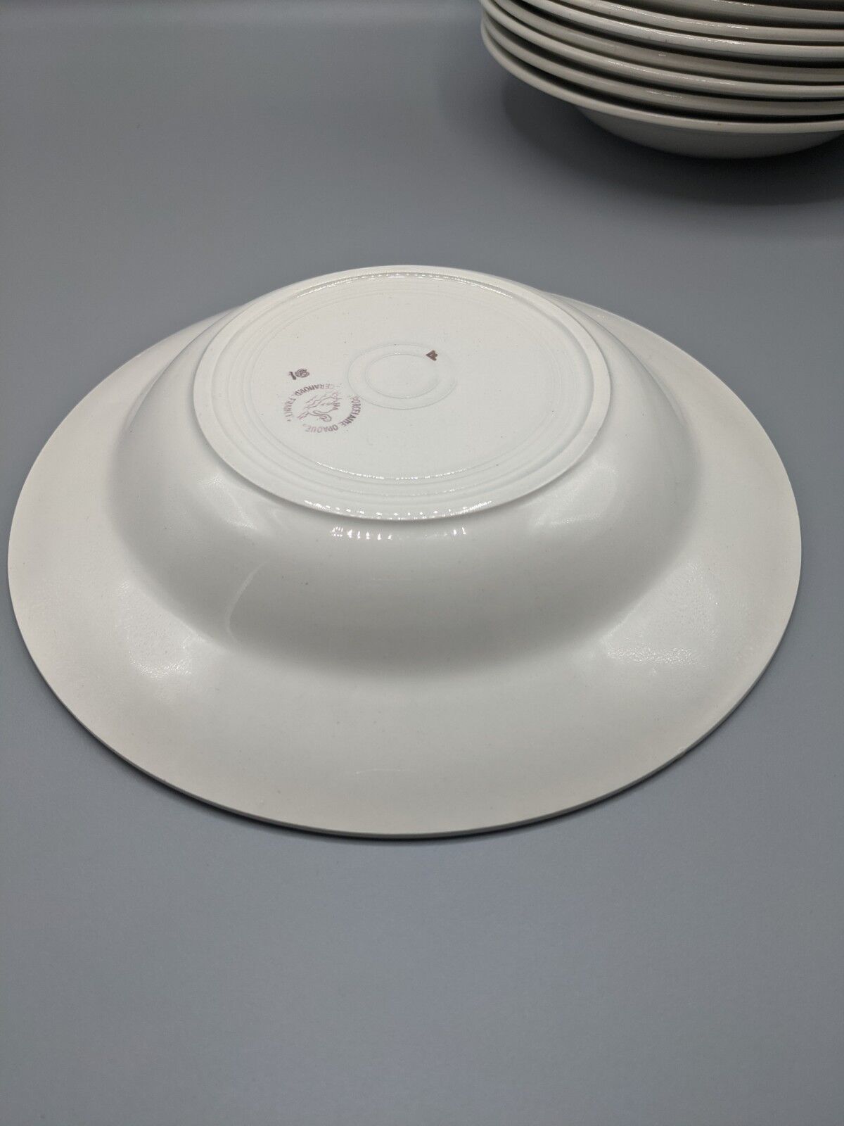 12 hollow porcelain plates, floral decoration and golden ledé - ∅: 23cm