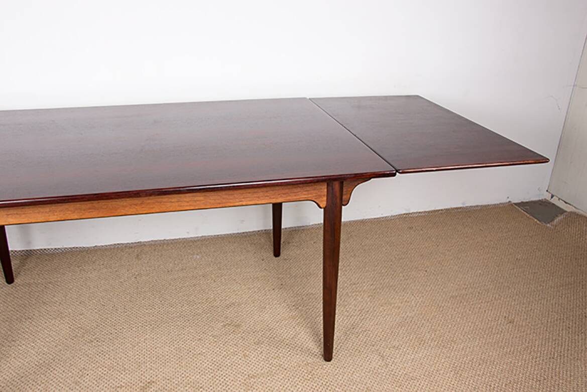 Danish extendable dining table in rosewood, model 54 by Gunni Omann