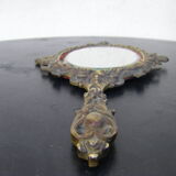 Hand-facing mirror in gilded bronze