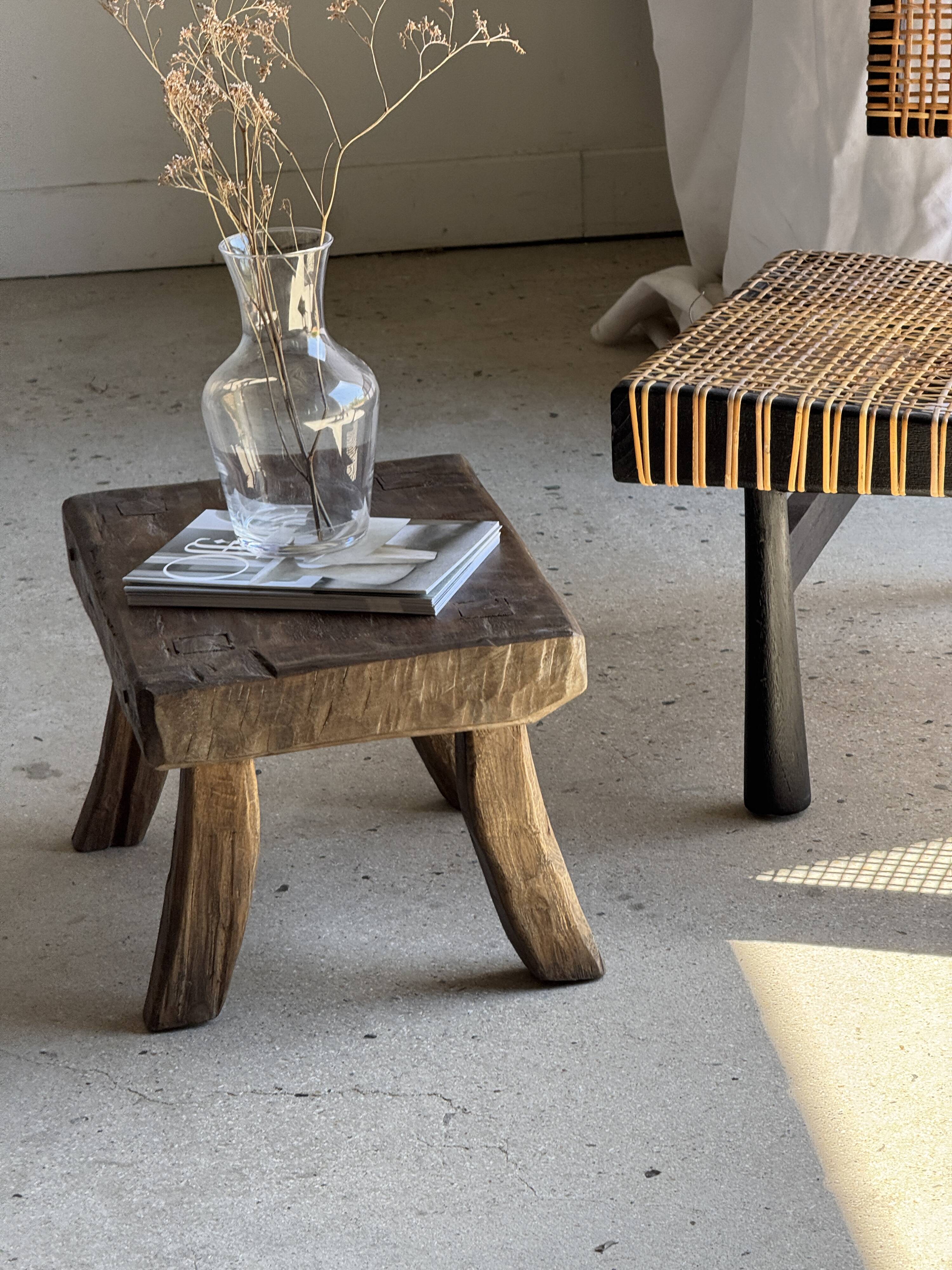 Small stool, rectangular solid teak side table with curved legs.