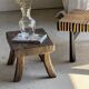 Small stool, rectangular solid teak side table with curved legs.