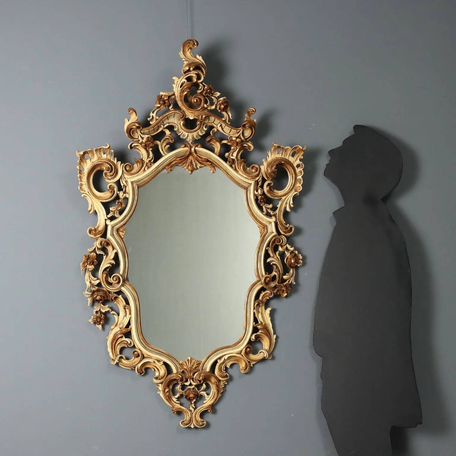 Antique lacquered and gilded wooden mirror, Italy, early 20th century.
