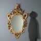 Antique lacquered and gilded wooden mirror, Italy, early 20th century.