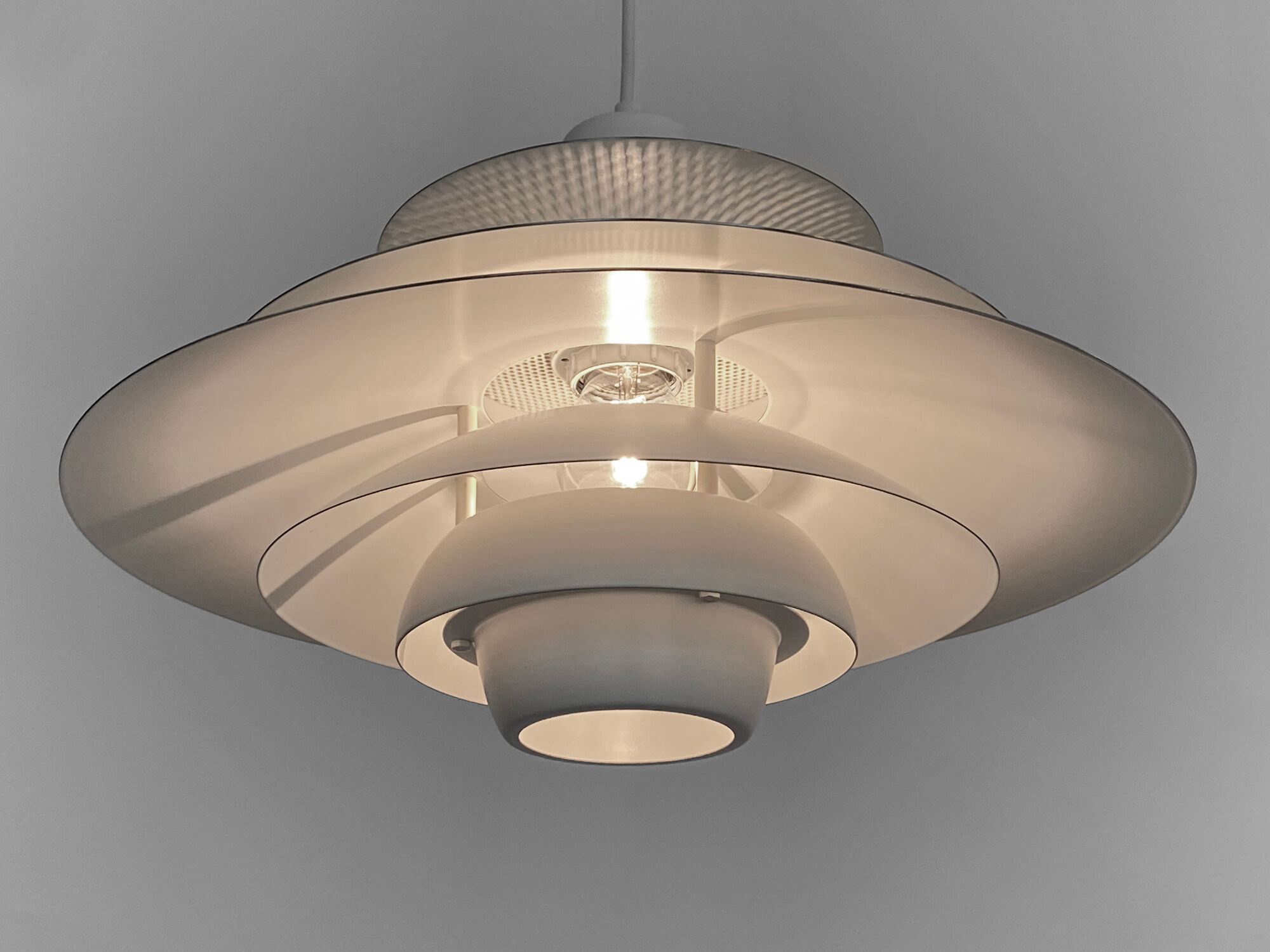 Multi layered pendant light by Kurt Wiborg for Jeka Metaltryk. Denmark 1970s
