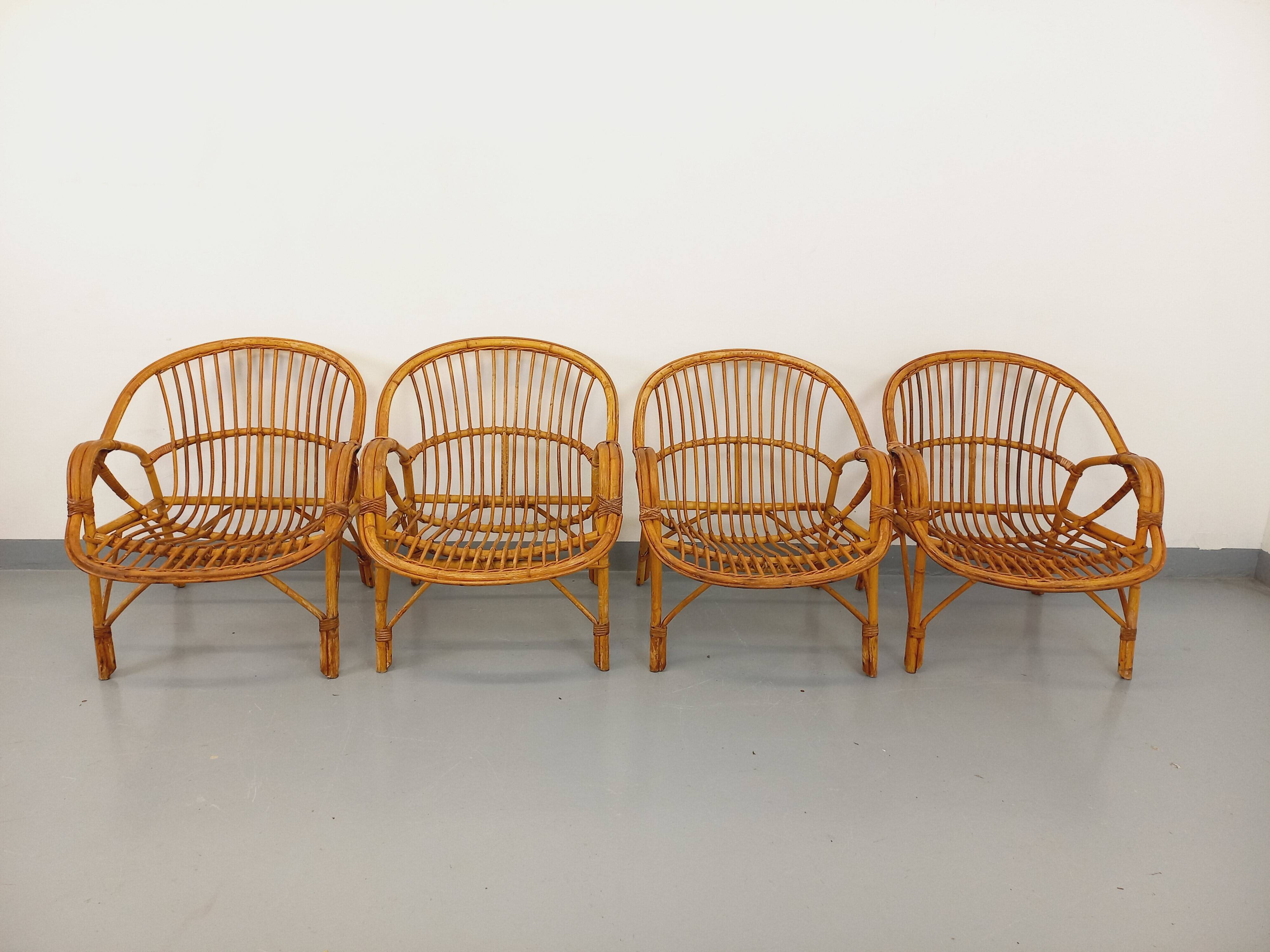 Set of 4 vintage rattan armchairs from the 60s