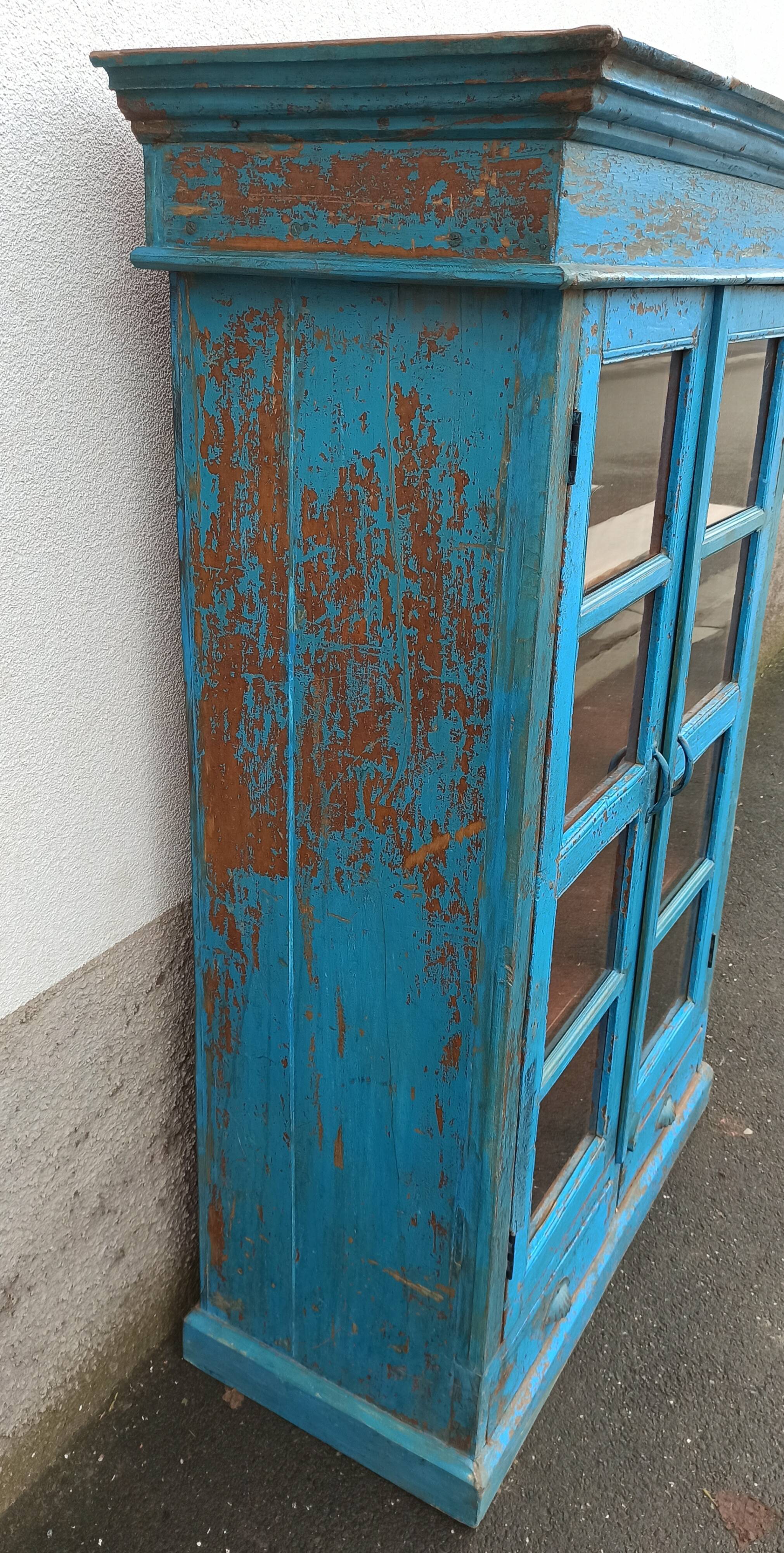Old wooden glazed cabinet with two doors and two drawers
