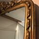 Large antique mirror with flagship shell in wood and gilded stucco