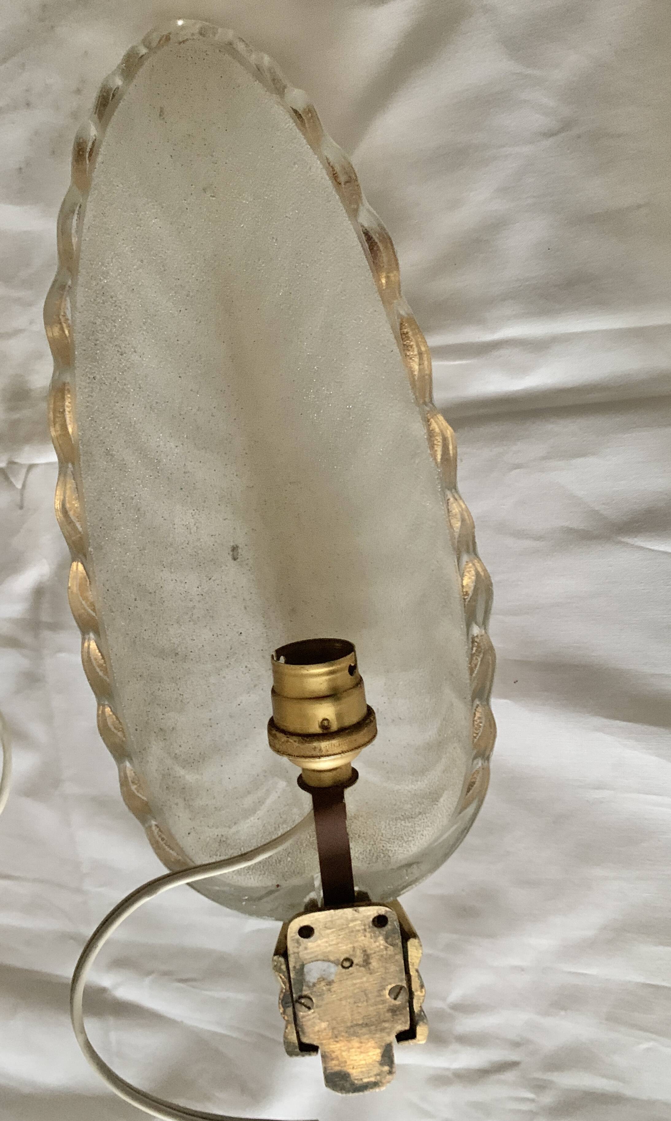 Glass and bronze wall lights from the 40s