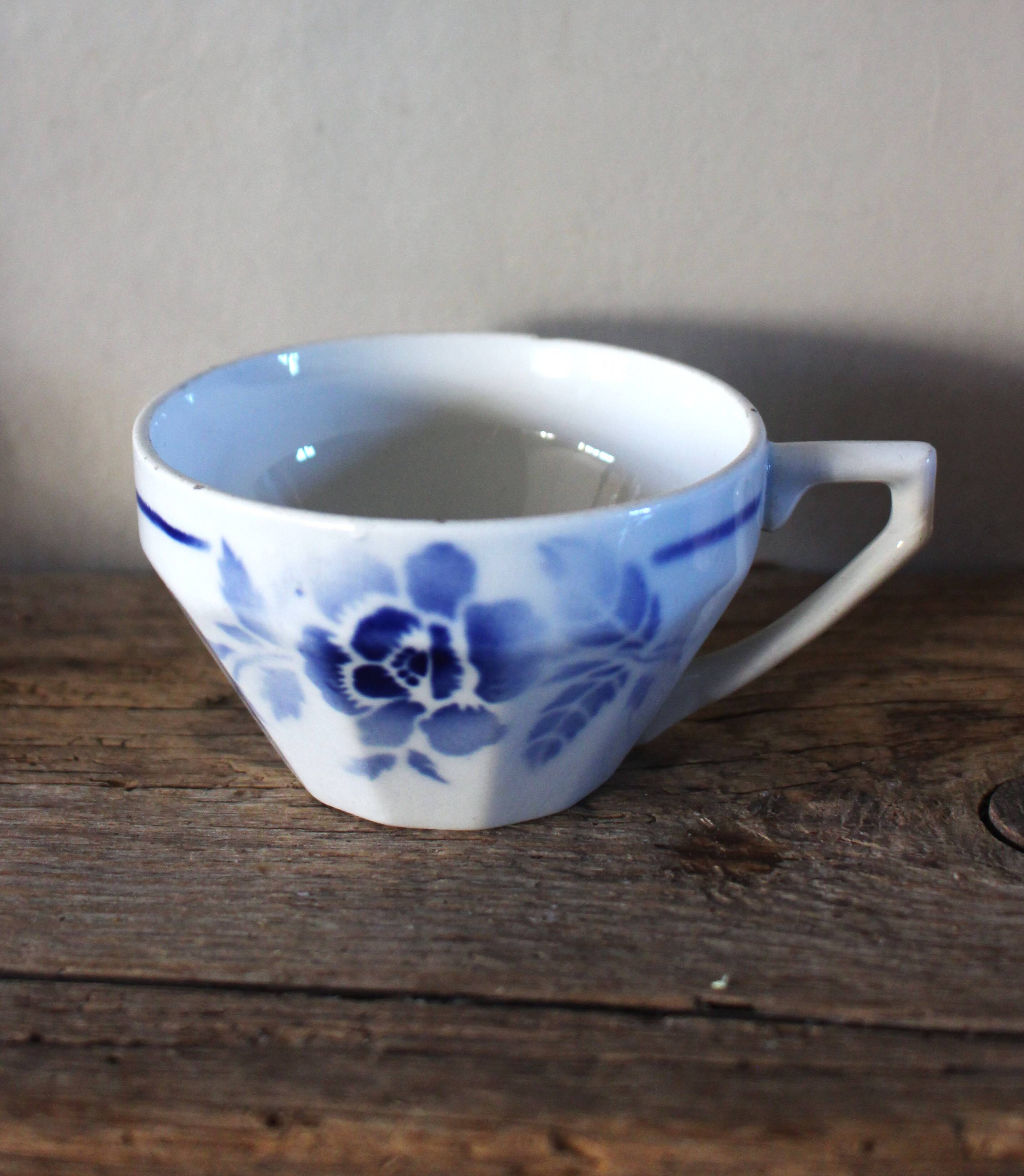 A set of 2 Digoin Sarreguemines cups with pink and blue flowers.