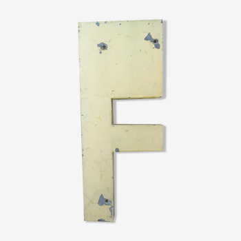 Vintage yellow sign letter F