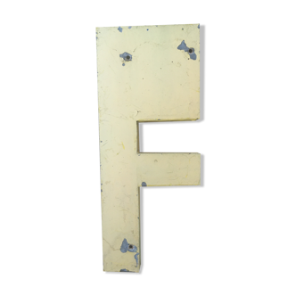 Vintage yellow sign letter F