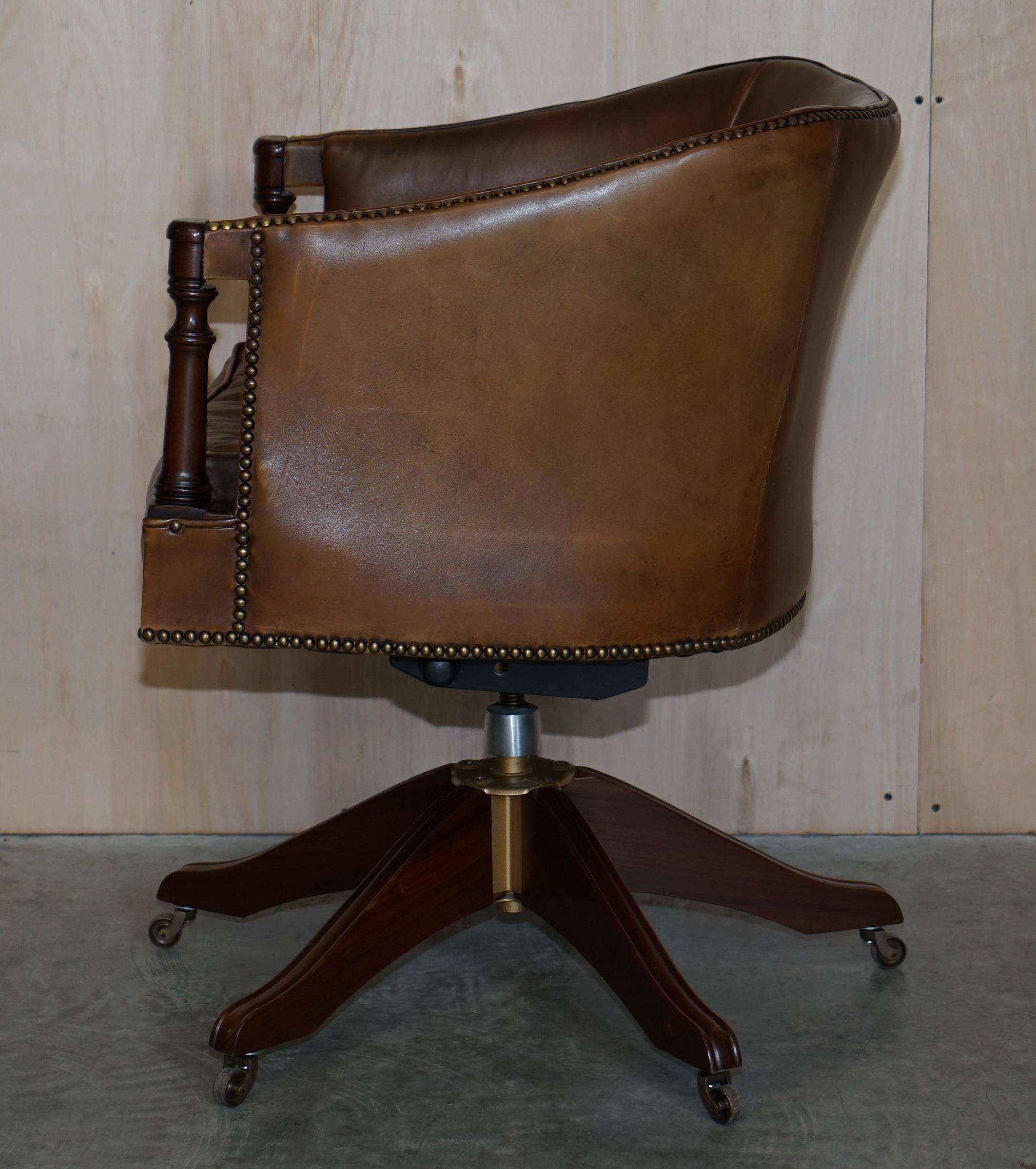 Vintage Patinated Leather Chesterfield Swivel Captain's Armchair