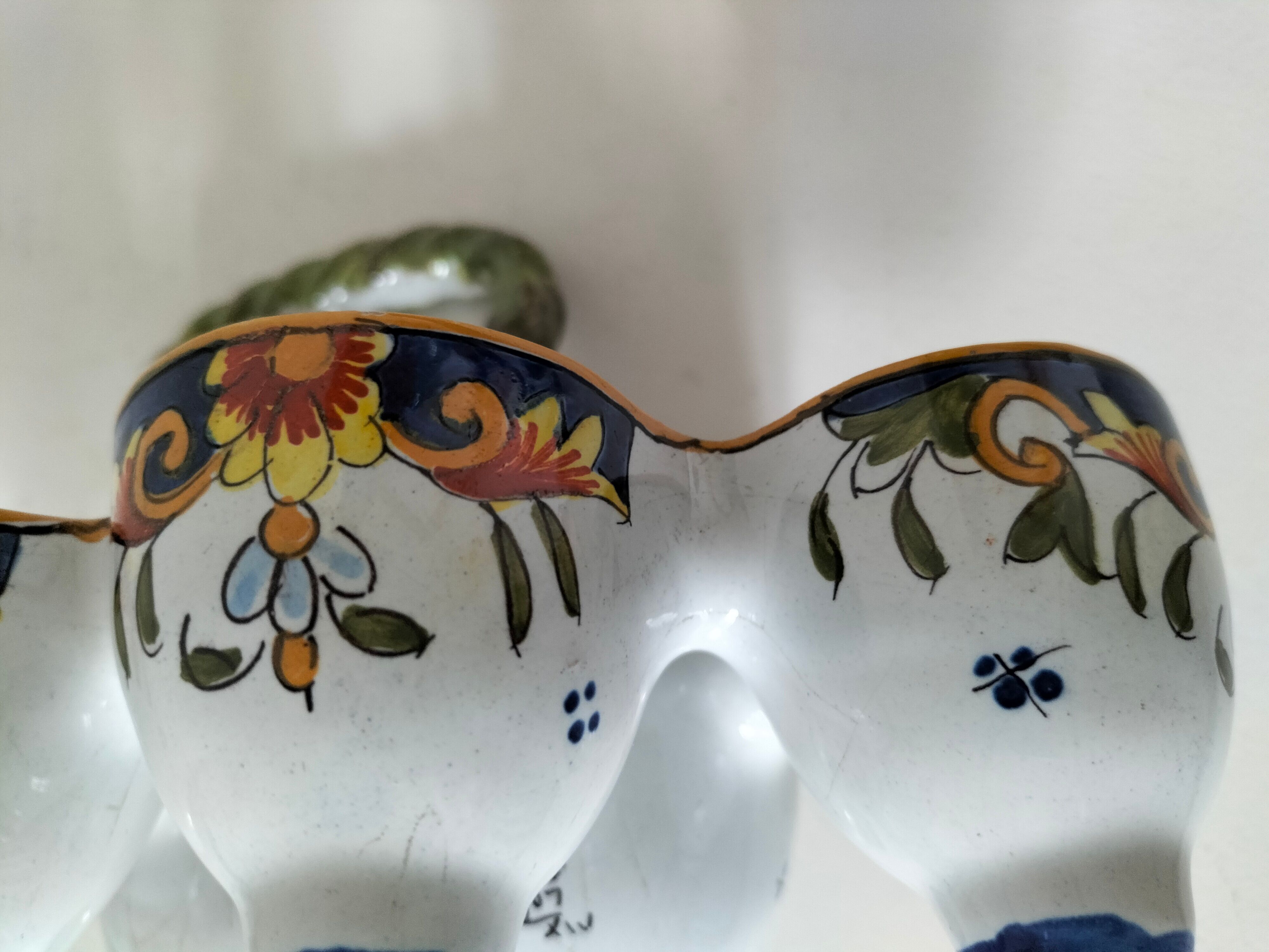 Antique egg holder by Jules Verlingue with polychrome floral decoration.