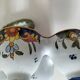 Antique egg holder by Jules Verlingue with polychrome floral decoration.