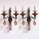 Maison Baguès, pair of wall sconces in wrought iron and gilded sheet metal, crystal pendants.