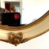 Mirror in wood and stucco with gilded highlights 20th century