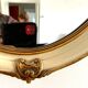 Miroir en bois et stuc a rehaut doré XX siècle