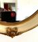 Miroir en bois et stuc a rehaut doré XX siècle
