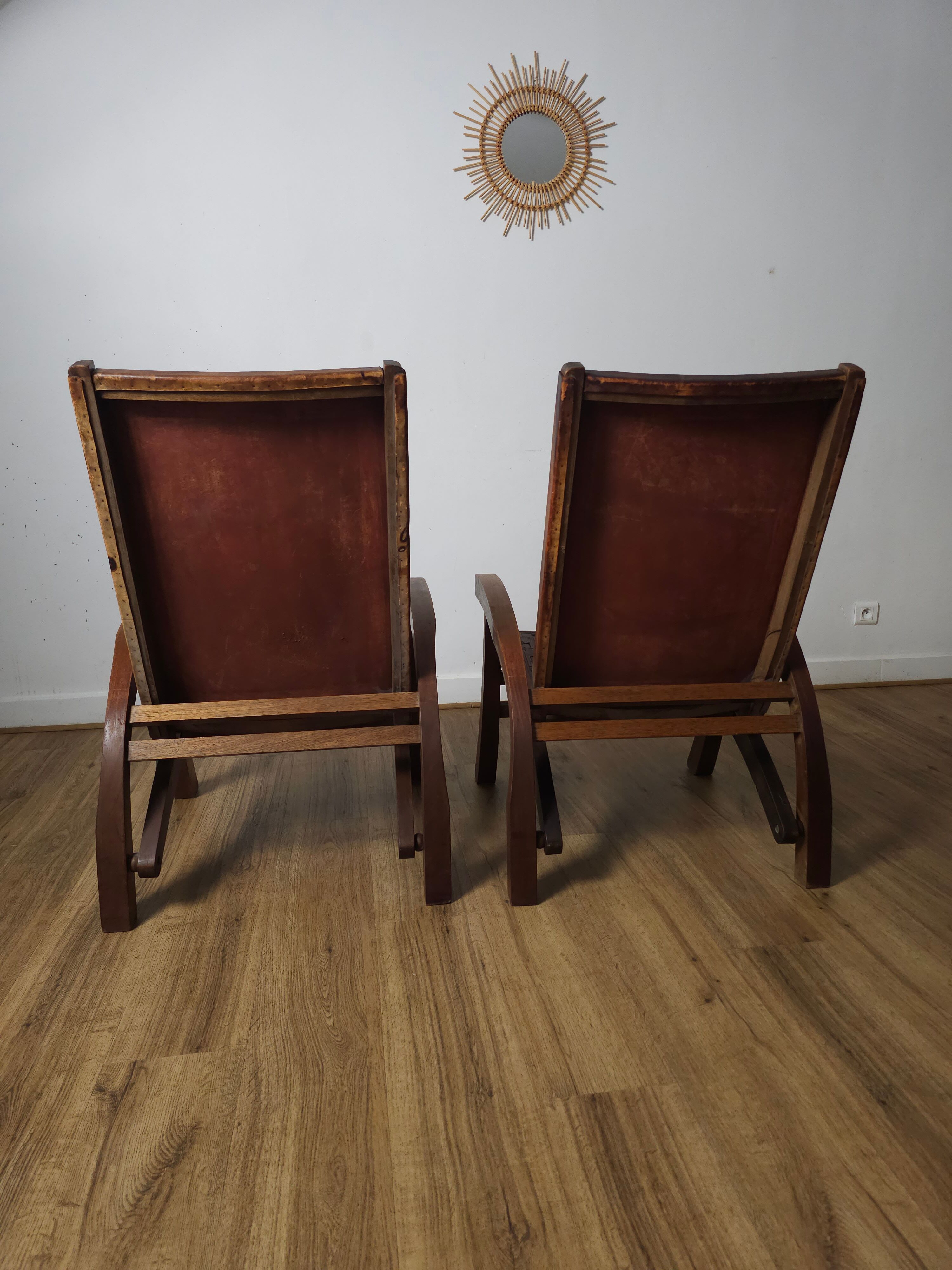 Leather and teak armchairs, by Angel Pazmino, circa 1960.