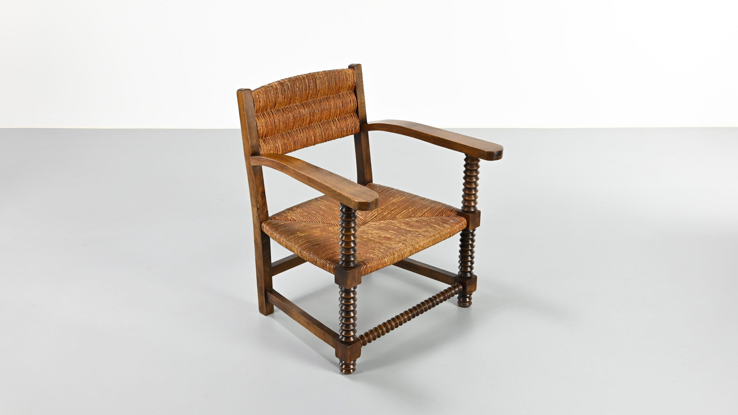 Pair of French armchairs with twisted legs in the style of Charles Dudouyt, France, 1940s.