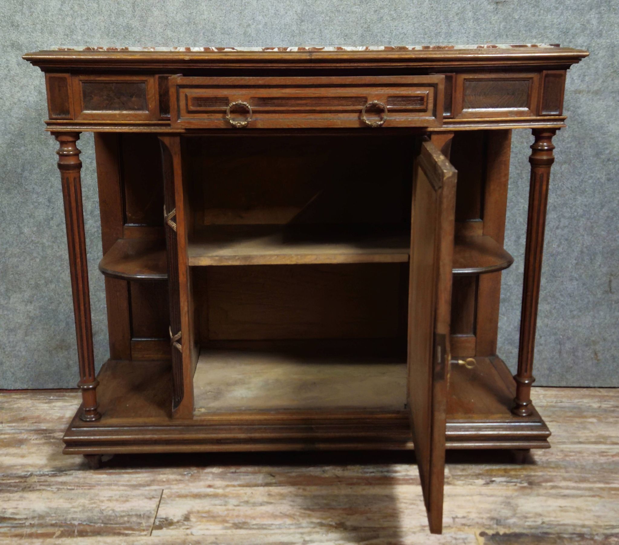 Antique low furniture of the buffet / sideboard / serving table type in Louis XVI style.