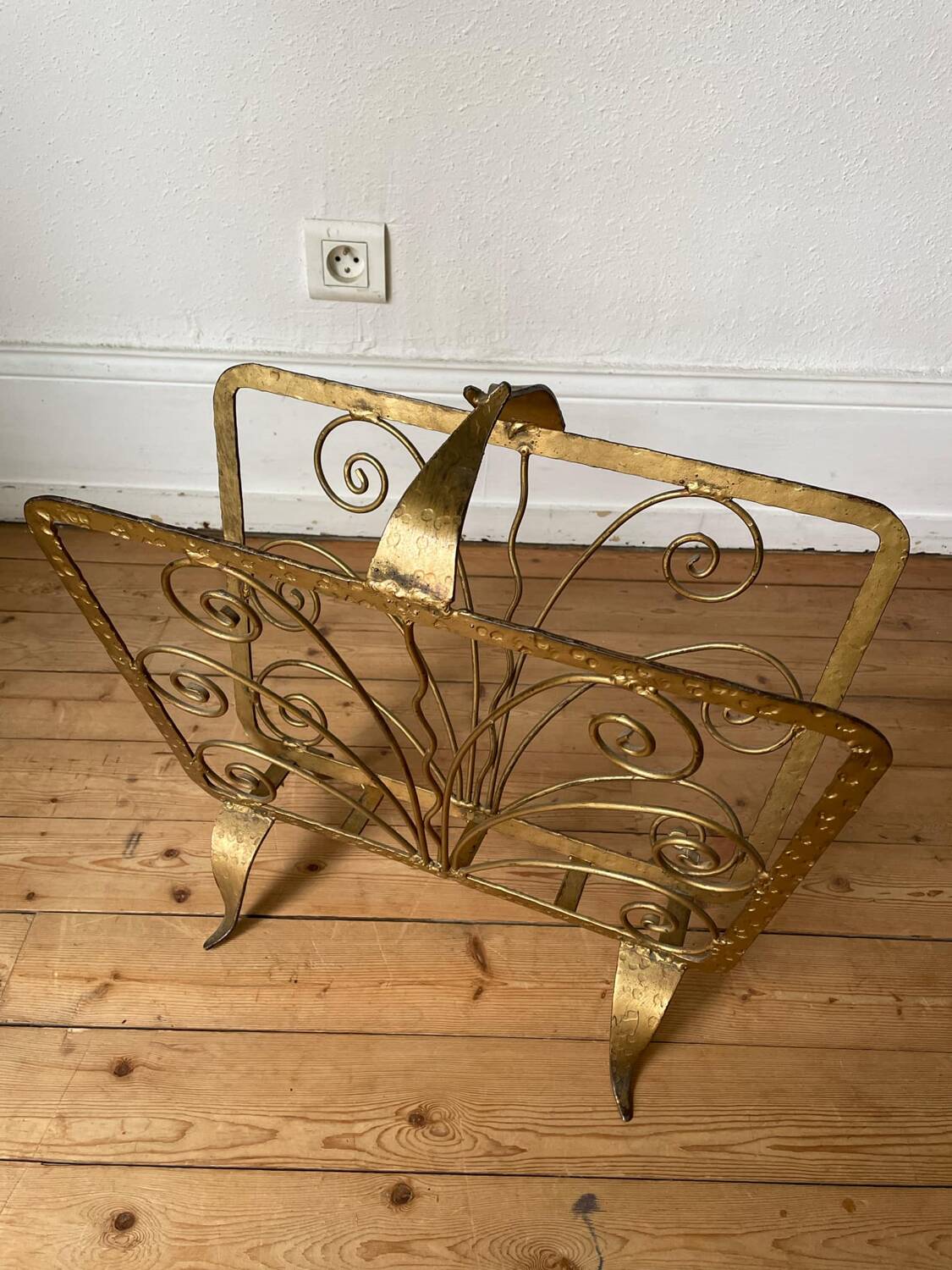 Vintage wrought iron magazine rack with gold butterfly design