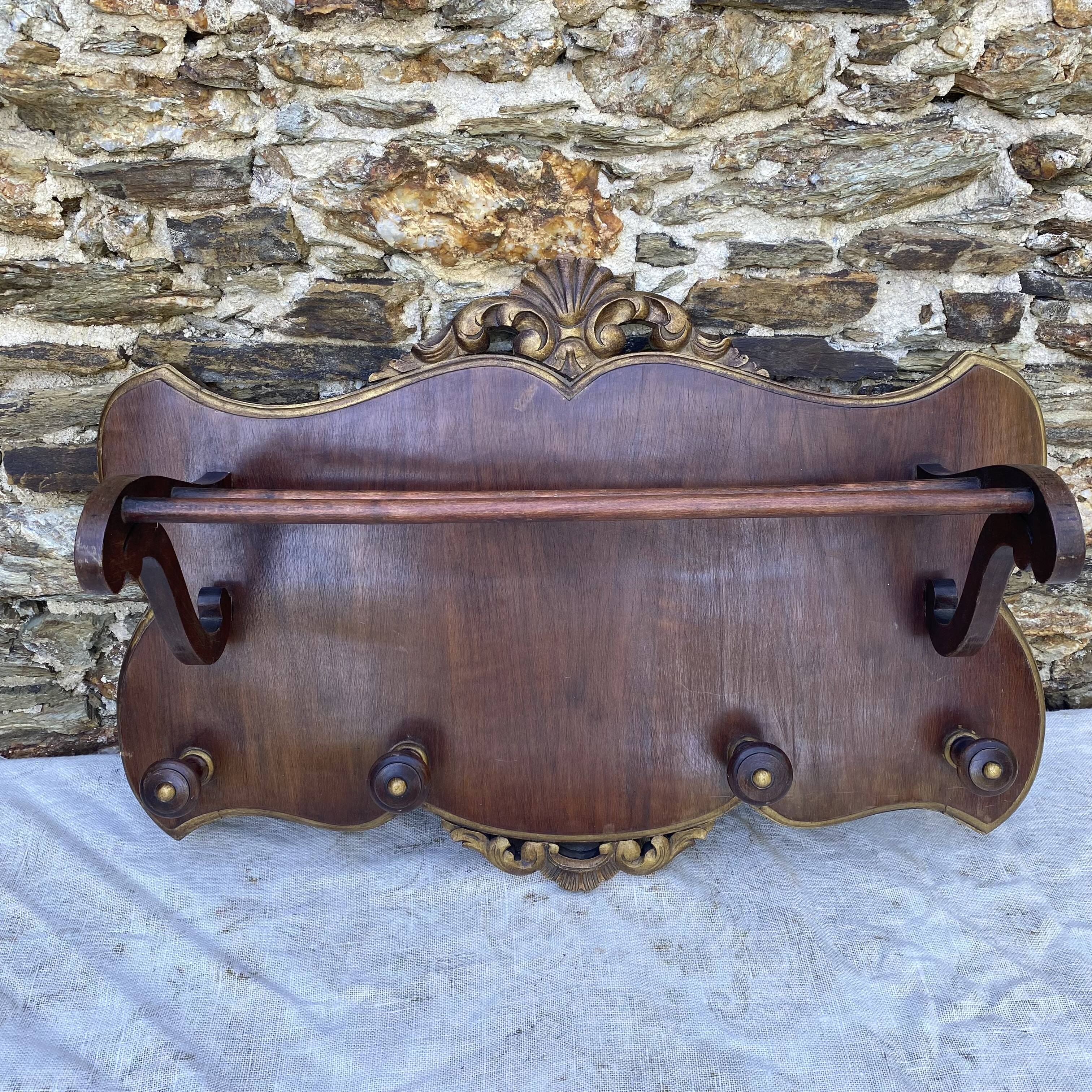 Coat rack and wall-mounted hat rack in an antique style.