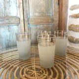 Lot of 4 white granite and gold glasses