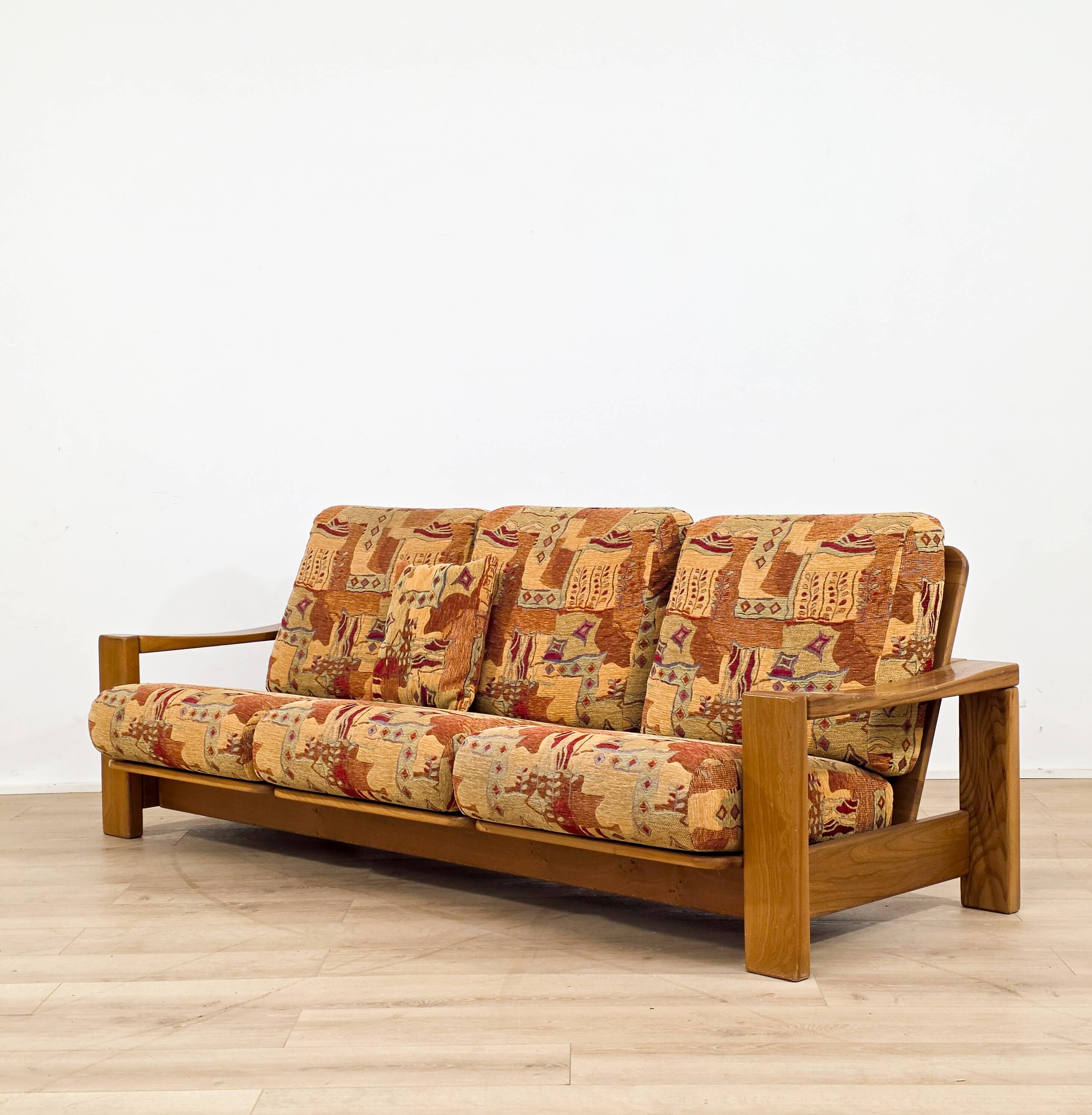 Solid elm sofa by Maison Regain from the 1970s.