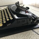 Machine à écrire remington portable en état de marche