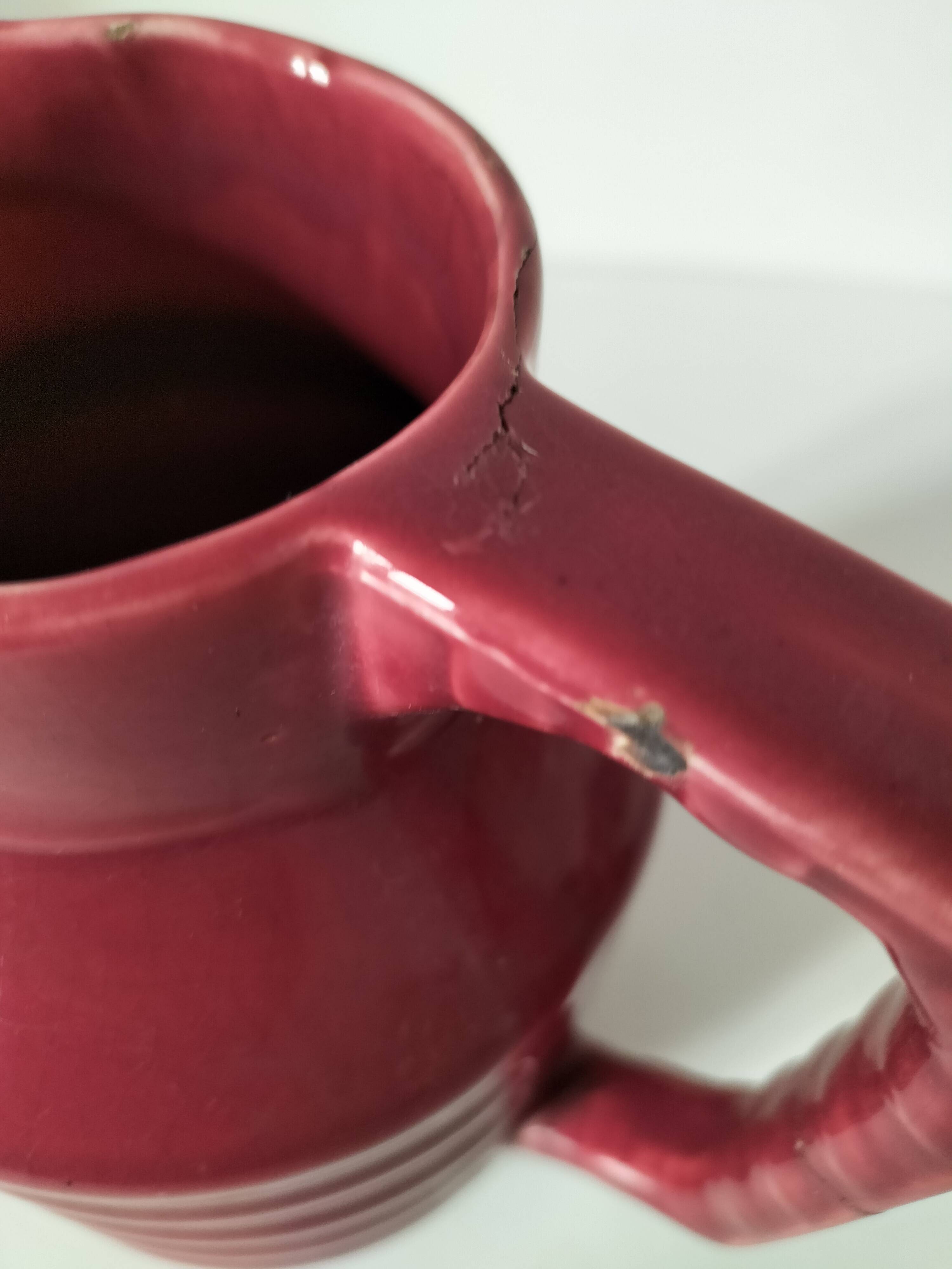 Old raspberry red pitcher from Onnaing, early 20th century.
