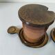 Pair of glazed stoneware cups with saucers and lids