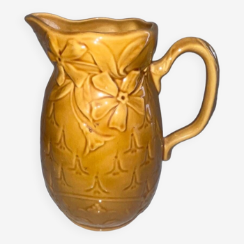 Old pitcher decorated with flowers