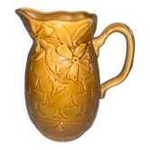 Antique pitcher with flower decoration